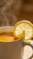 steaming mug of turmeric water with lemon slice