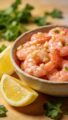 Travel Solo As A Women All Across The Globe!!! Air fryer garlic shrimp in bowl, lemon wedges, parsley