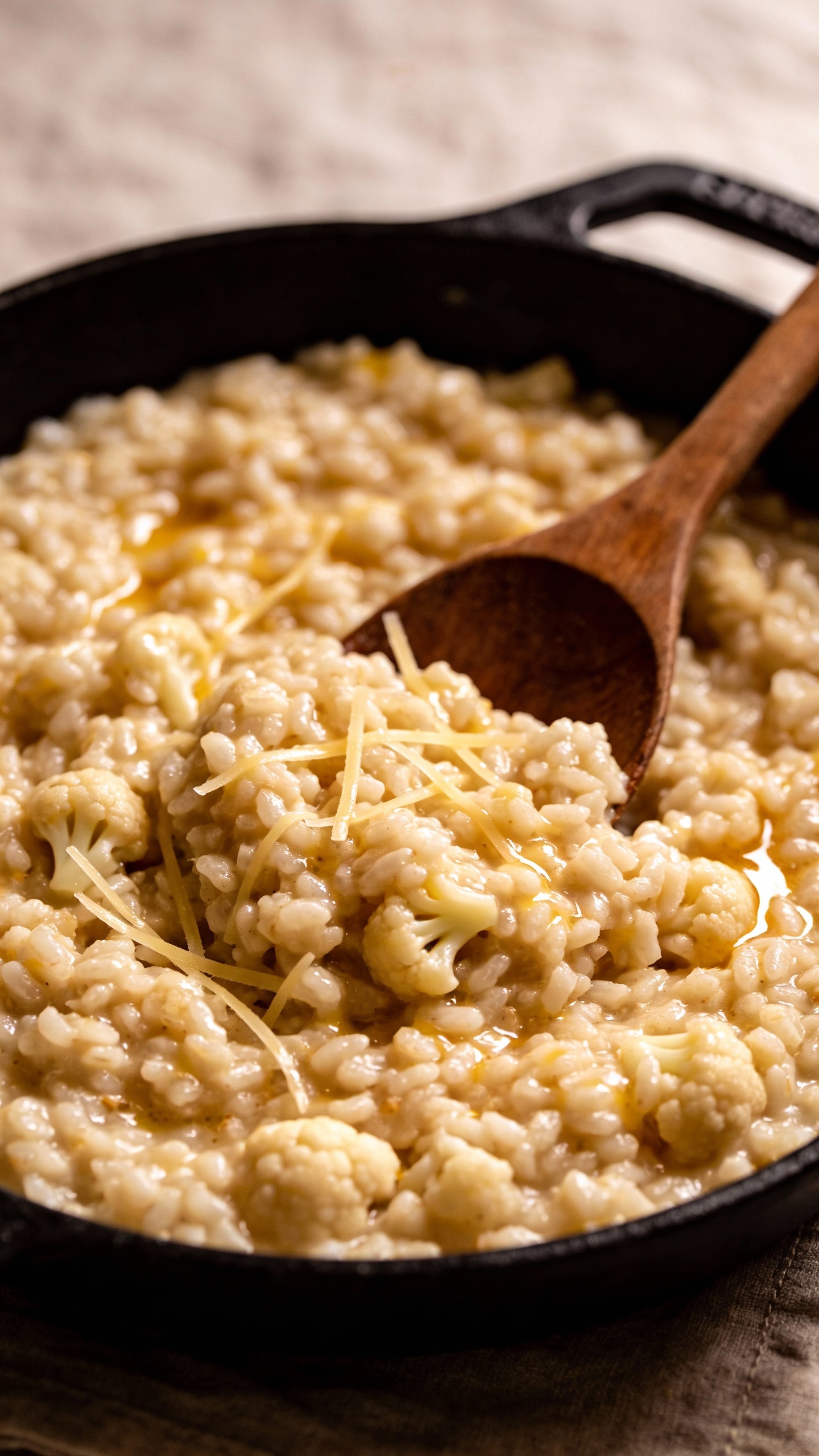 creamy cauliflower rice risotto in skillet, glossy finish