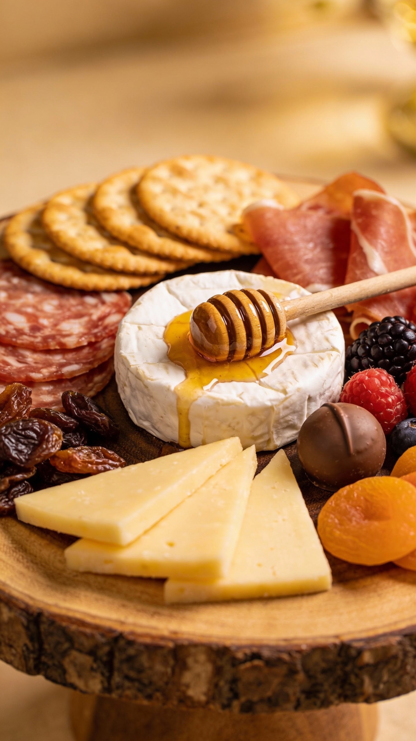 Sweet and savory snack board on wooden platter