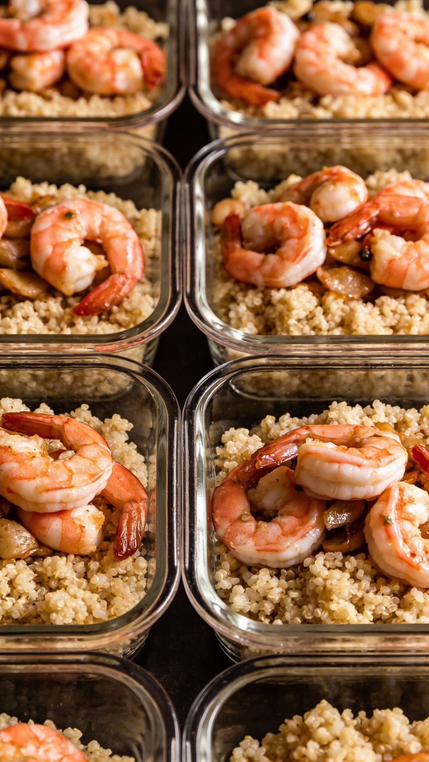 Shrimp and cauliflower rice meal prep containers, overhead lighting
