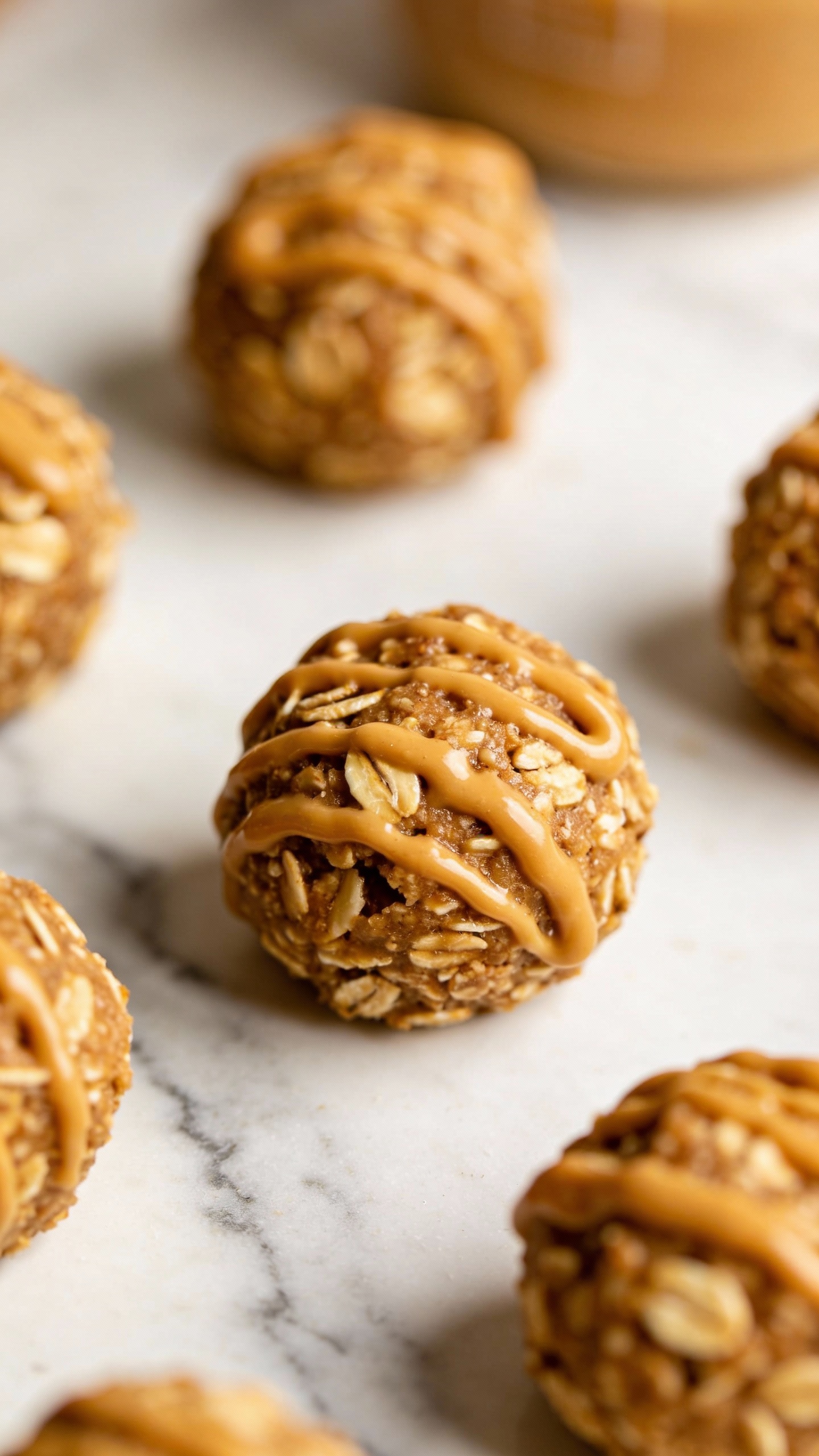 Peanut butter oat energy bites on white marble